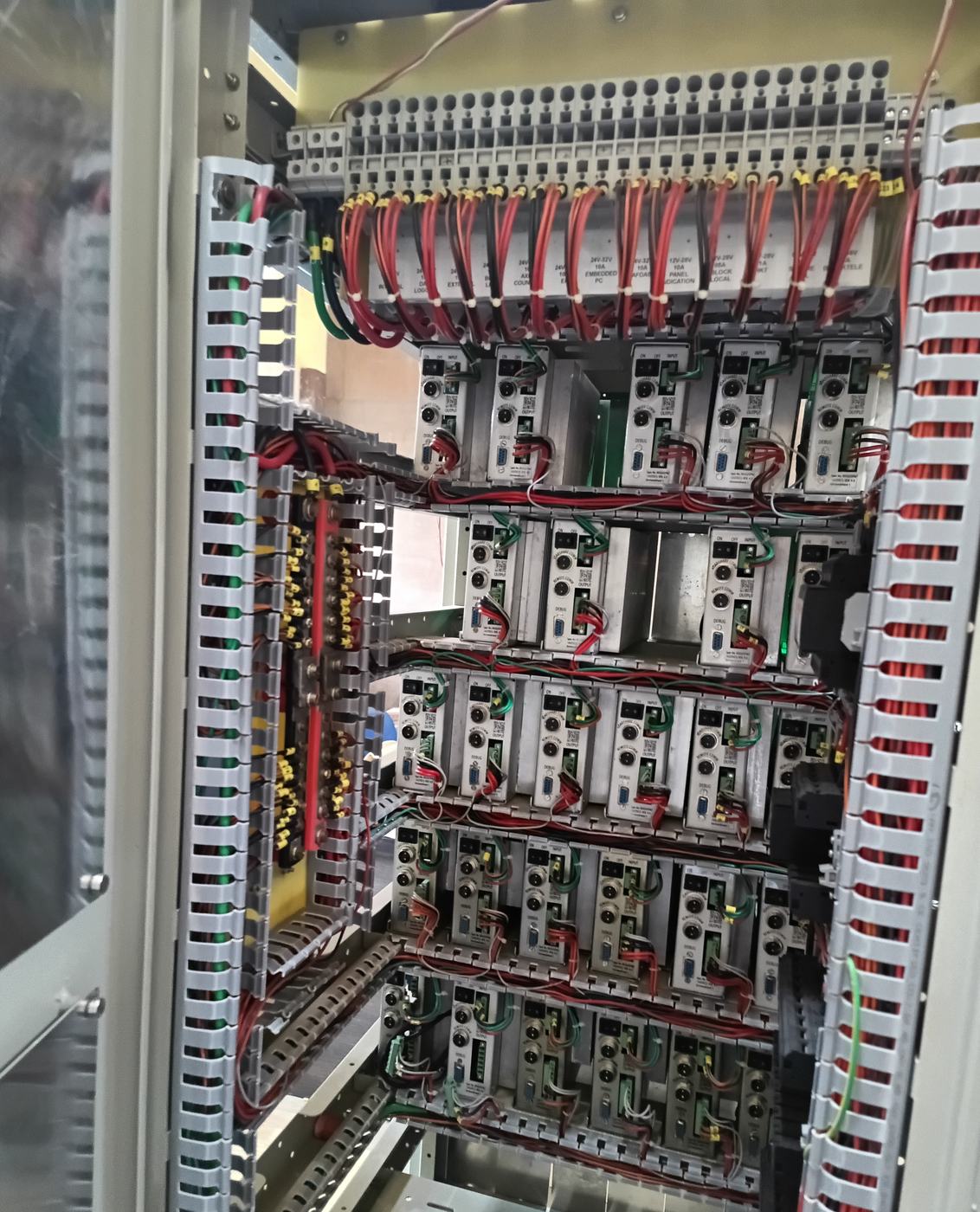 Inside of an open rack showing module bays and wiring harness