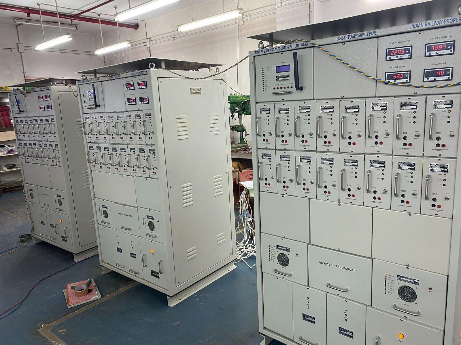 Three tall grey LC-IB-RH power supply cabinets marked Indian Railway Property, with rows of meters and modules